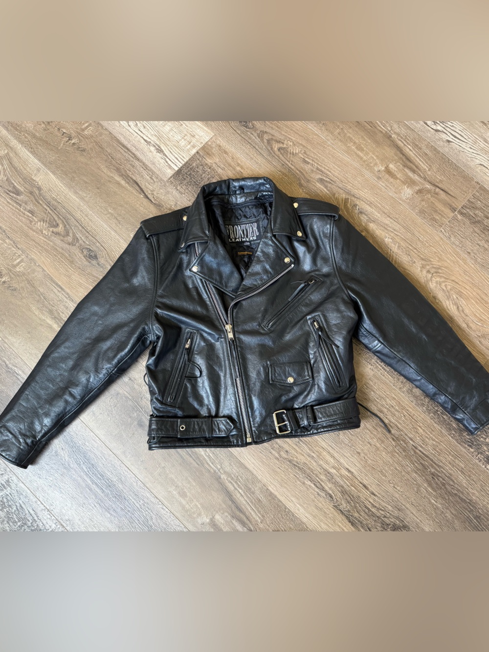 Vintage Black Leather Moto Jacket with Belted Waist and Laced Accents